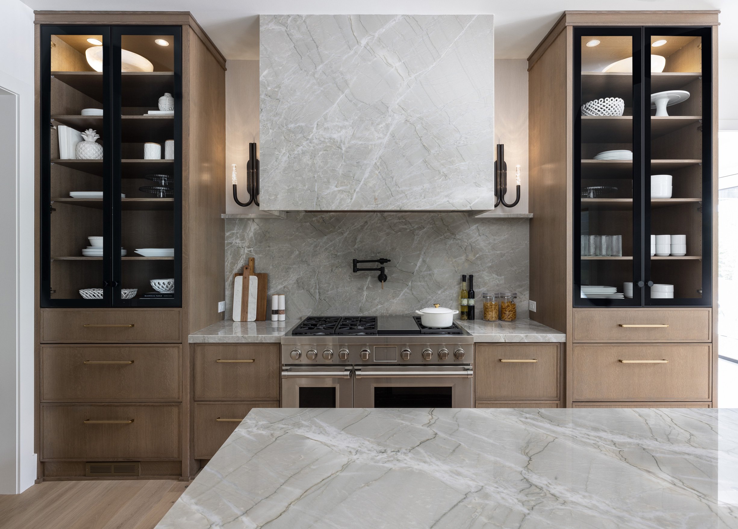 Modern kitchen featuring slim shaker and glass cabinetry