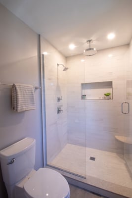 Anatolia Mayfair Suave Bianco tile, Kohler Memoirs plumbing fixtures, rain shower head