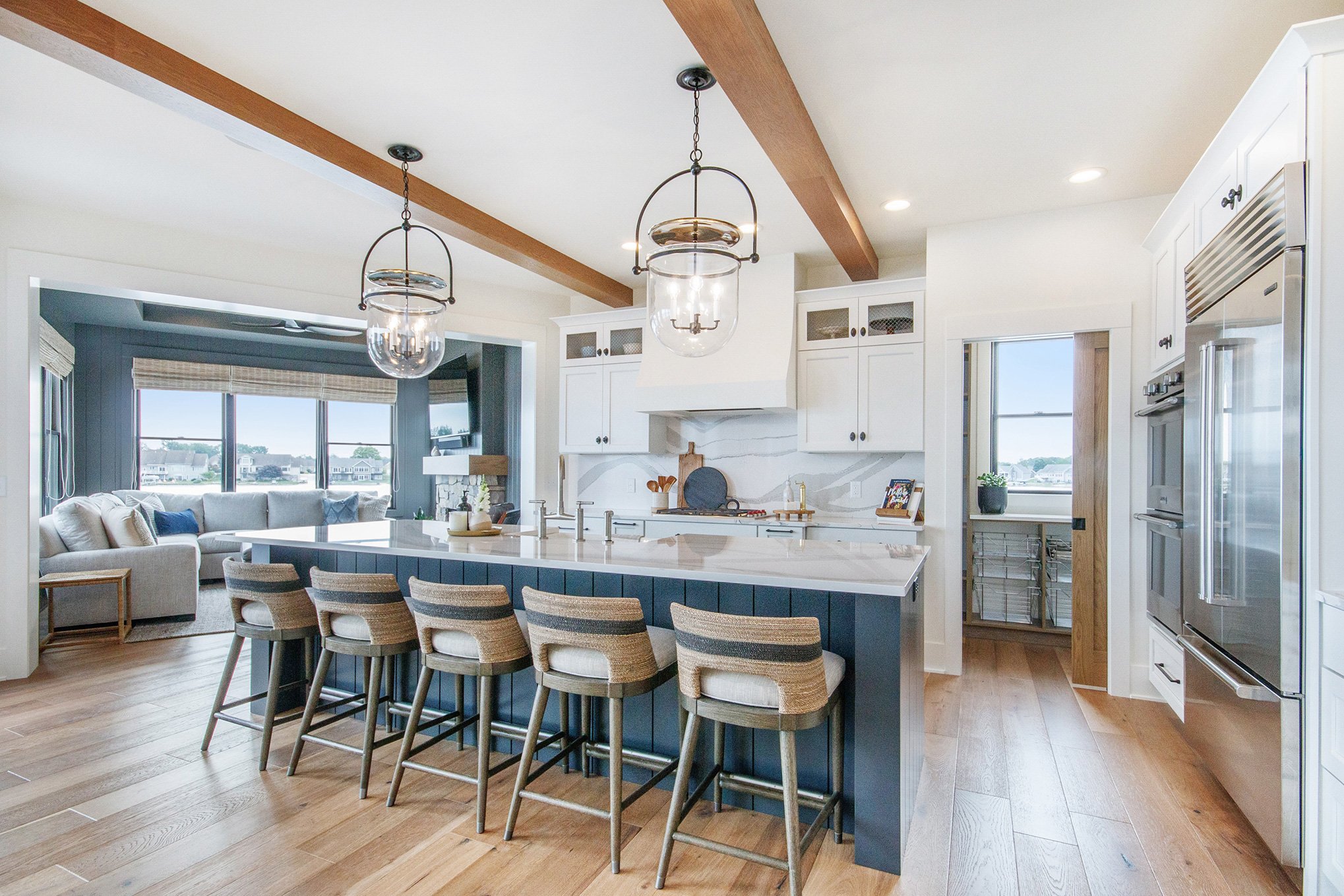 Pioneer shaker cabinets shown.  Perimeter in Polar; island in Bracing Blue.  Designed by Ruth Westra for Ledger Builders.