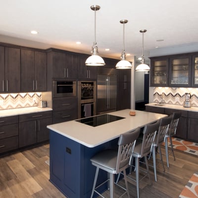 Kitchen designed by Julie Kerjes at Starlite Kitchens, featuring Pioneer cabinetry.  Perimeter: Winchester door style in maple with Graphite finish.  Island: Townsend door style with custom Sherwin Williams paint 6244 - Naval