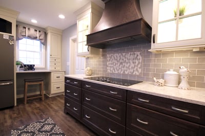 Kitchen designed by Carrolle Spence at Starlite Kitchens, featuring Mid Continent cabinetry.  Fridge wall: Villa door style in maple with Antique White finish.  Oven wall: Adams door style in oak with Slate finish