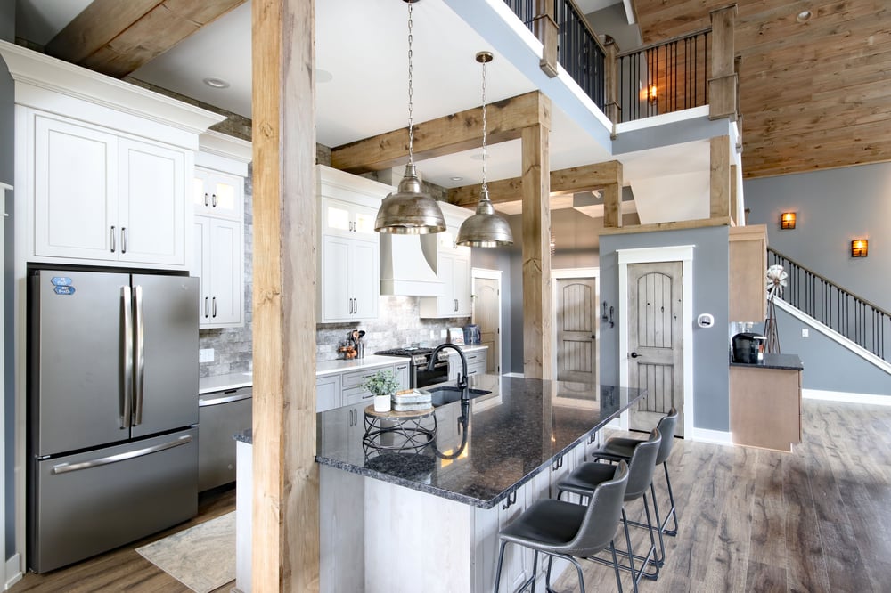 A large island with ample seating in a barndominum kitchen