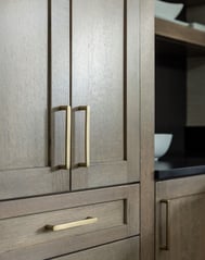 Dura Supreme Bria cabinetry in the Carson door style with quartersawn oak in Heather finish