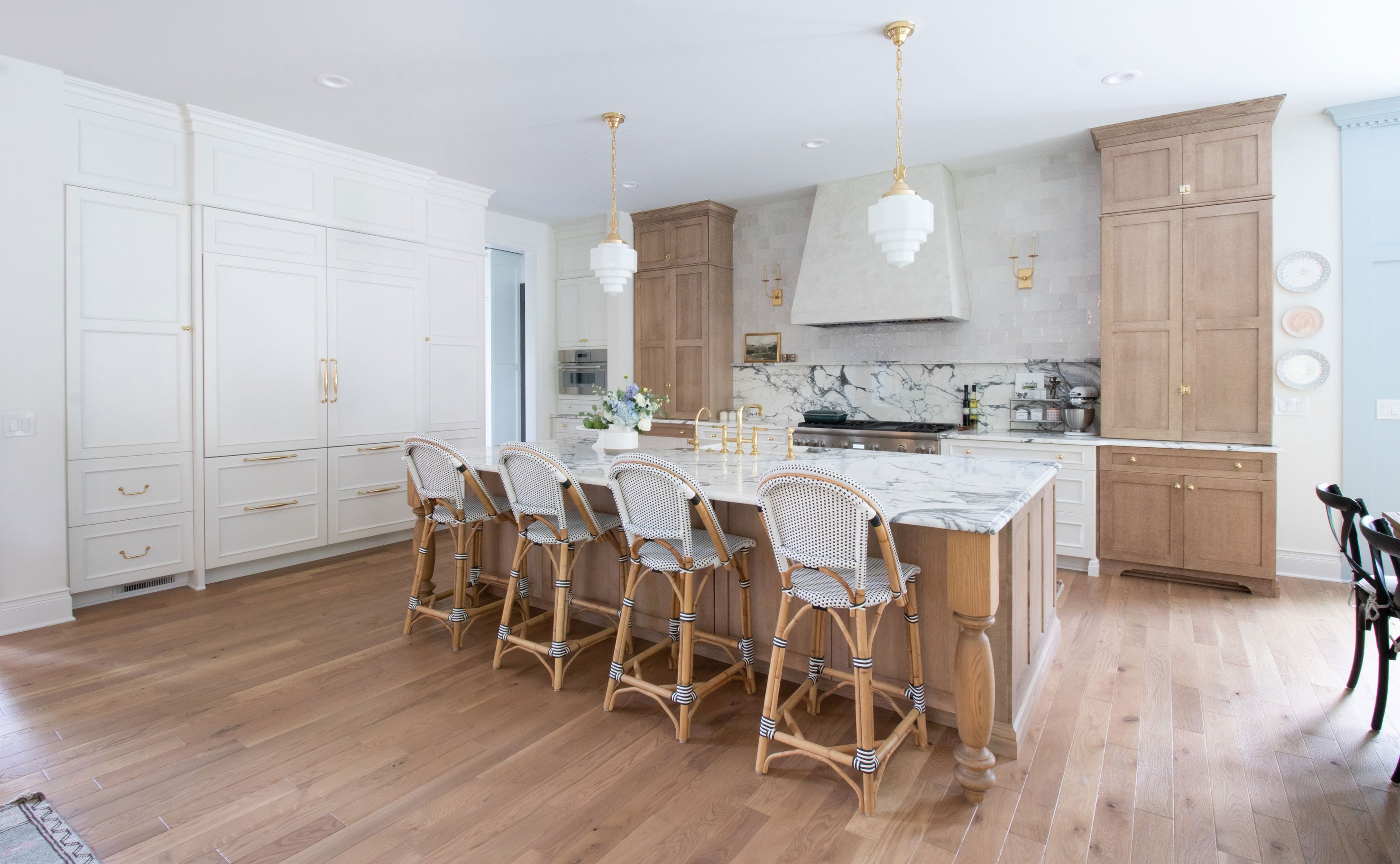 European style Transitional Kitchen featuring Design-Craft cabinetry in Devonshire door style with White Icing finish and Mission door style with Cappuccino finish