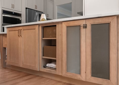 Pet nook featuring Masterpiece Cabinetry in the Coleson door style with maple in Wicker stain