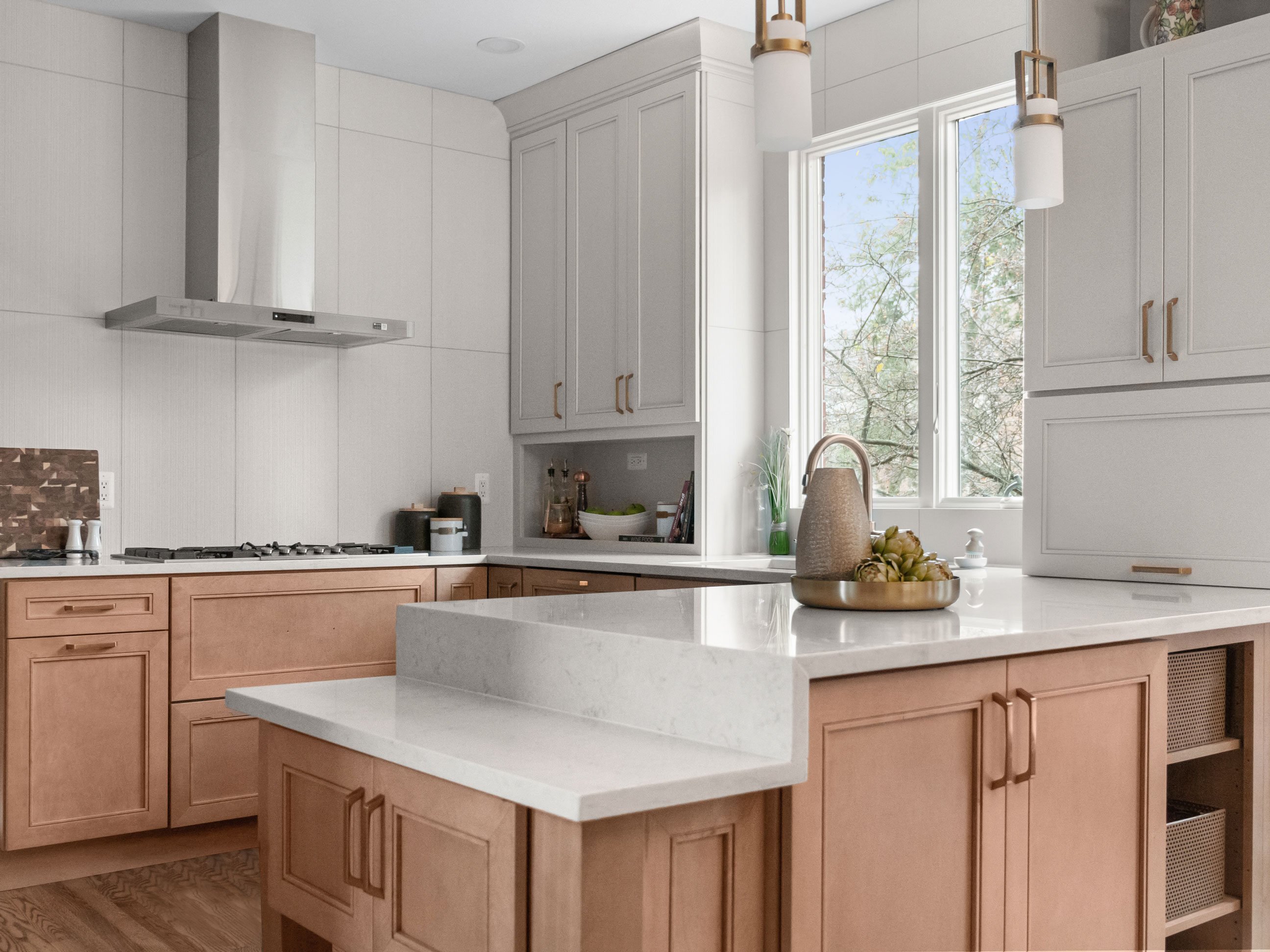 Kitchen incorporating vertical tile and tall upper cabinets.  Designed by KSI Designer Rose Kokali.