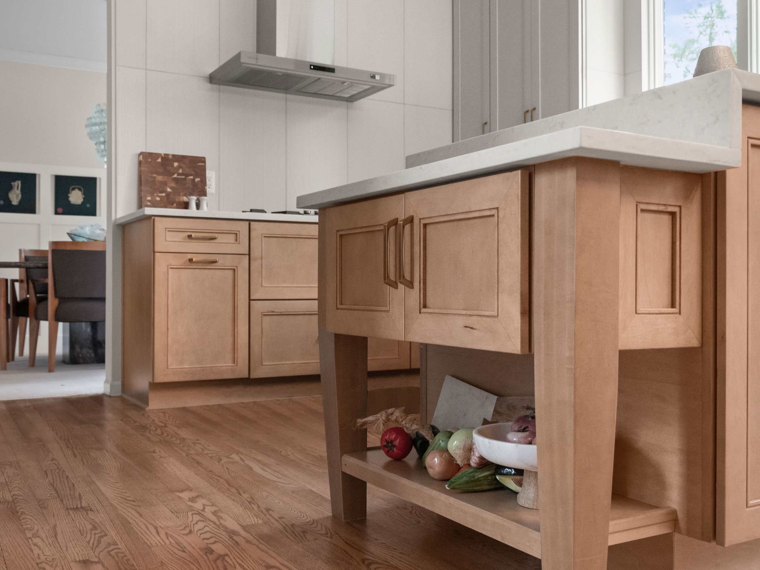 Kneading station featuring Masterpiece Cabinetry in the Coleson door style with maple in Wicker stain