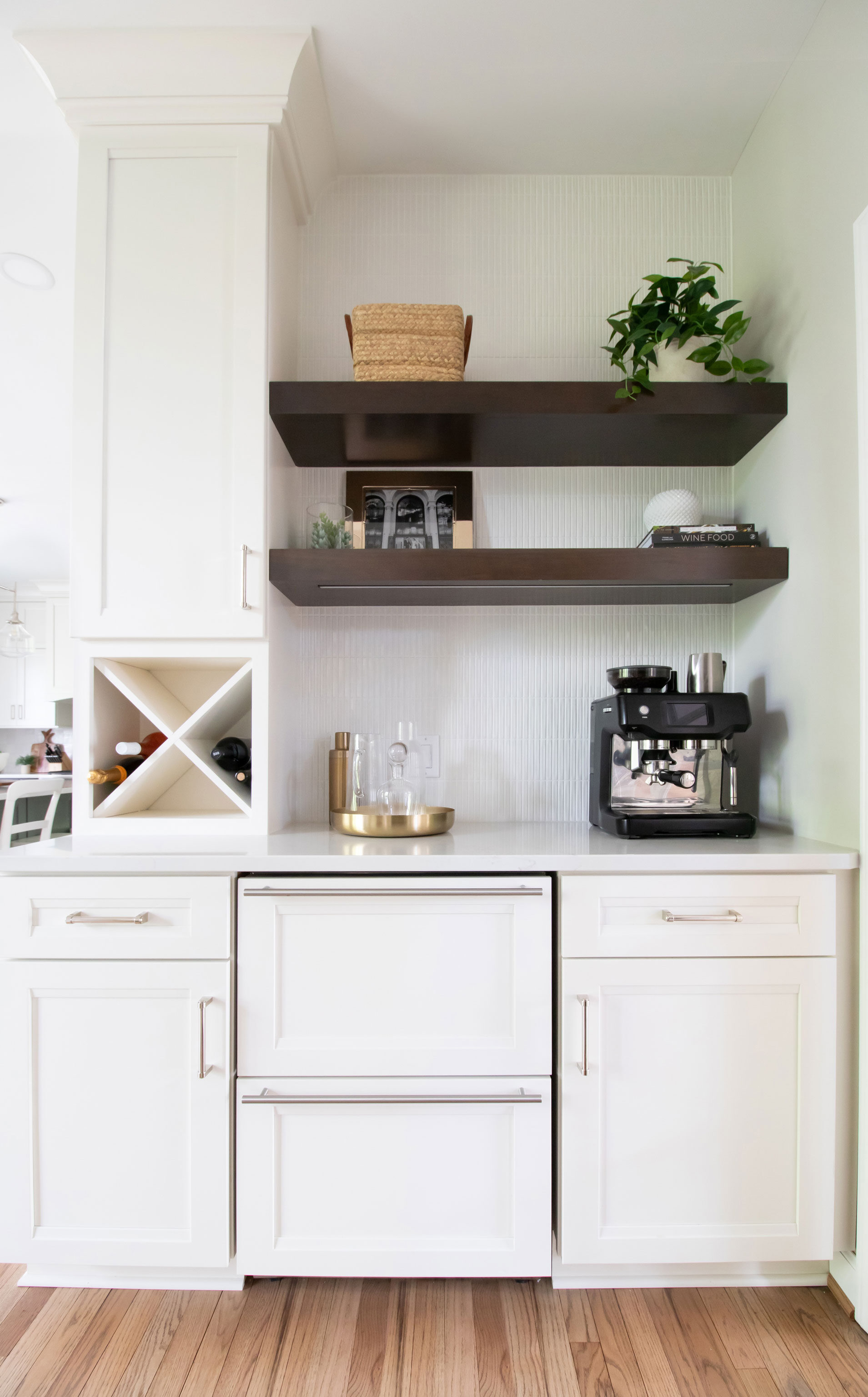 Merillat Masterpiece cabinetry in Sylvan door style, Maple wood painted Warm White.  Virginia Tile - Sweet Bars 5x10 White Gloss with bright white grout