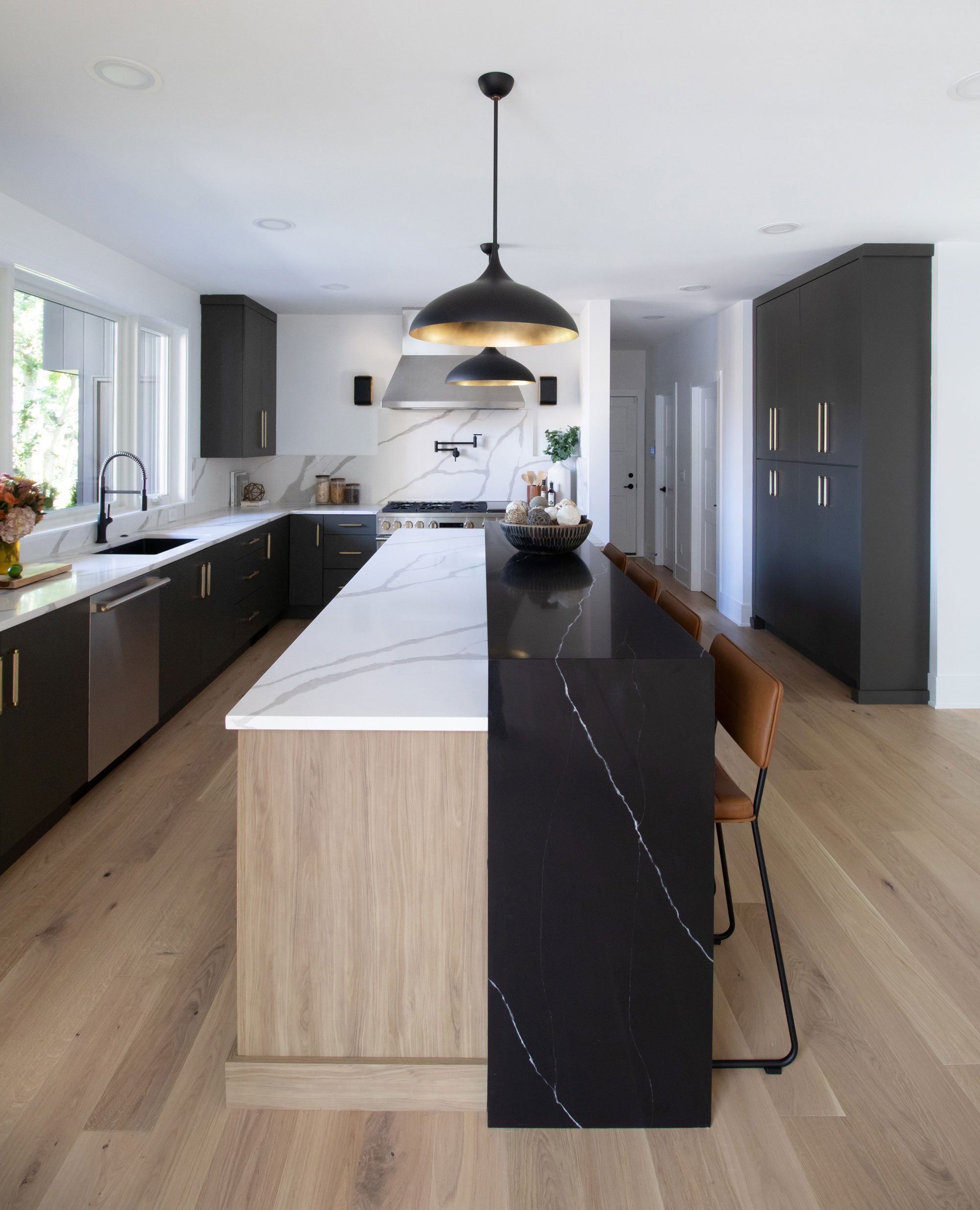 Contemporary kitchen featuring Inspira Cabinetry in the Milan door style with matte finish in Urbane Bronze and Chalet door style in textured melamine Peele finish