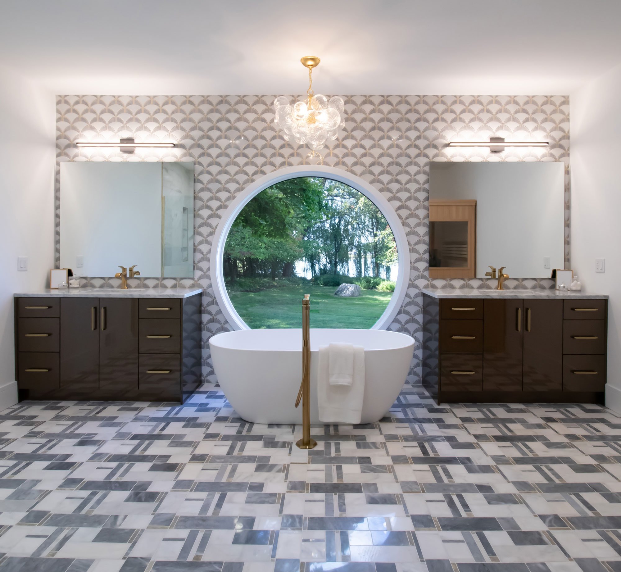 Master bath featuring Inspira Cabinetry vanities in the Horizon door style with a high gloss wired bronze finish