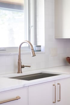 Inspira Cabinetry in the Aspen door style with Accessible Beige finish, with Rook Collection faucet by Brizo