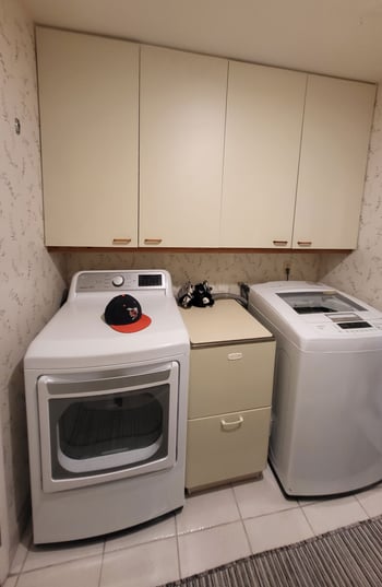 Original laundry room with side-by-side appliances