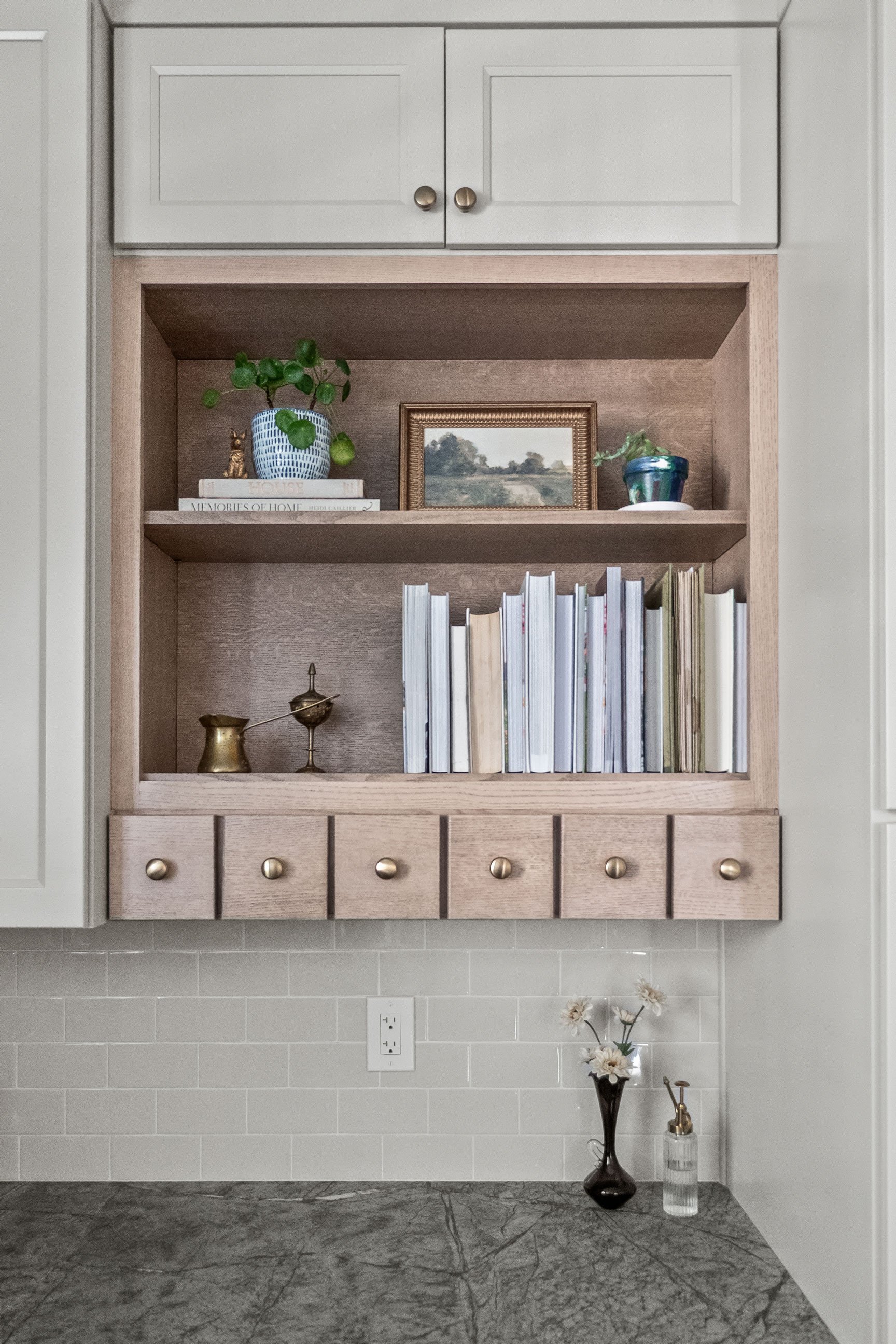 Bookshelves and apothecary drawers in expanded kitchen pantry nook