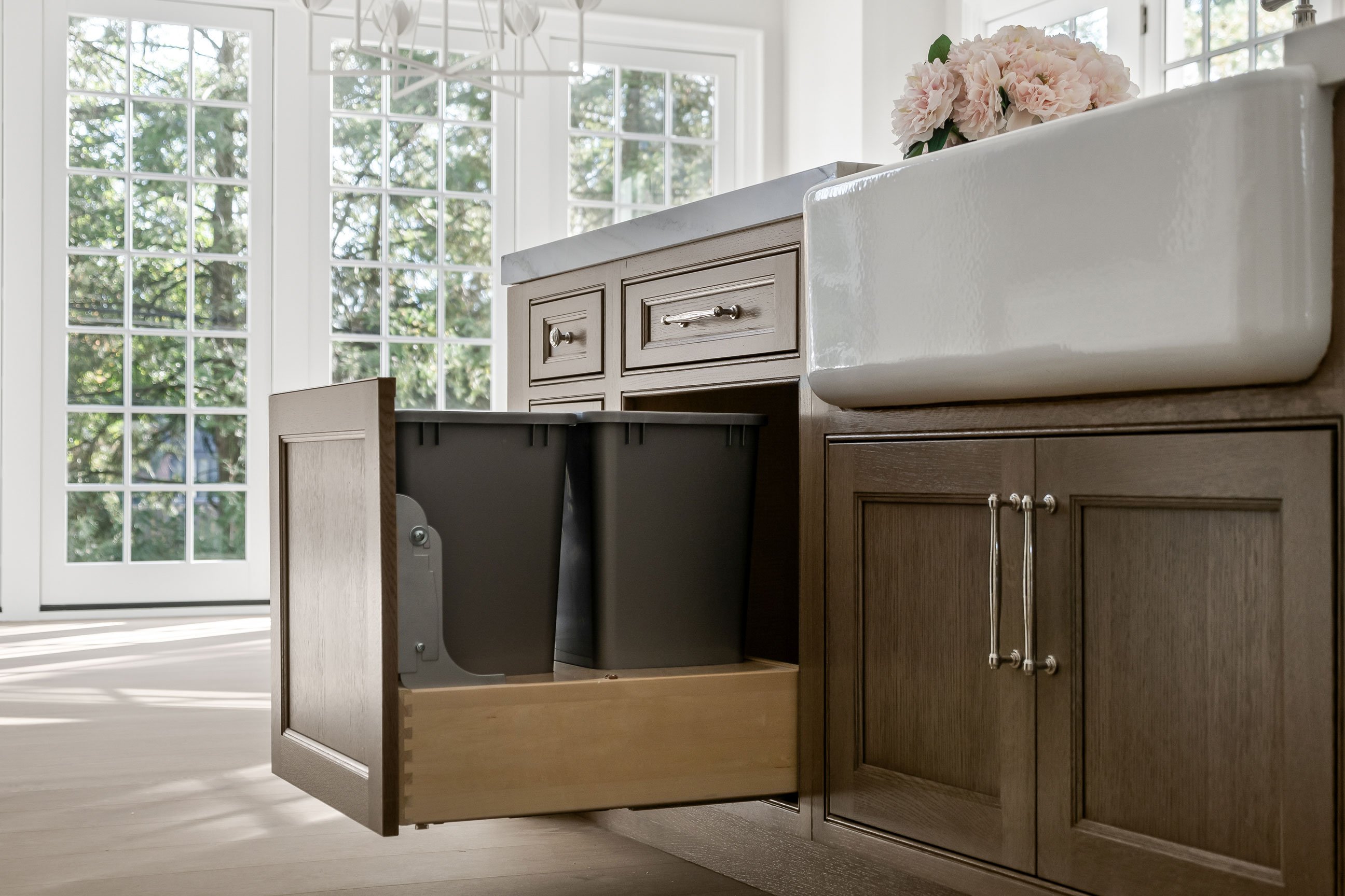 Trash pull-out drawer in the kitchen island.