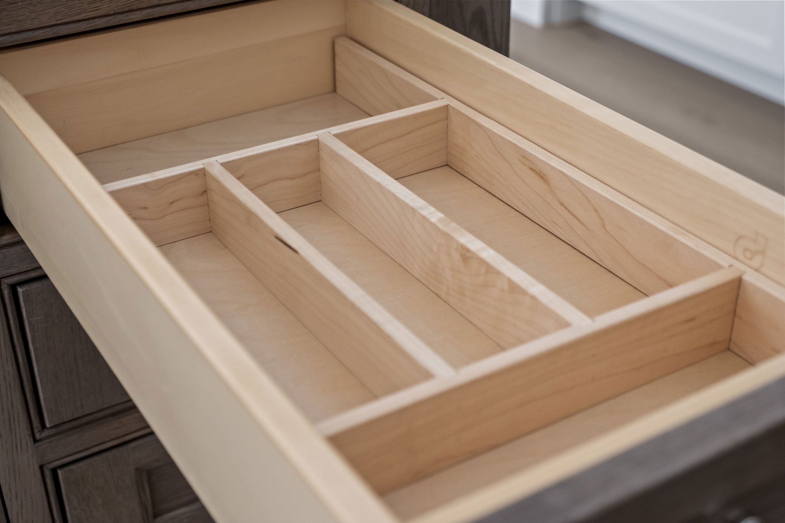 Cutlery dividers in a drawer in the kitchen island.