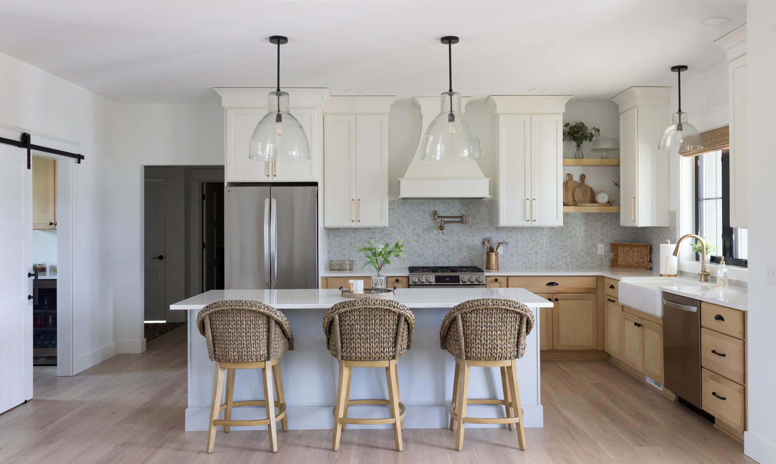 Tri-toned kitchen featuring paints and stains