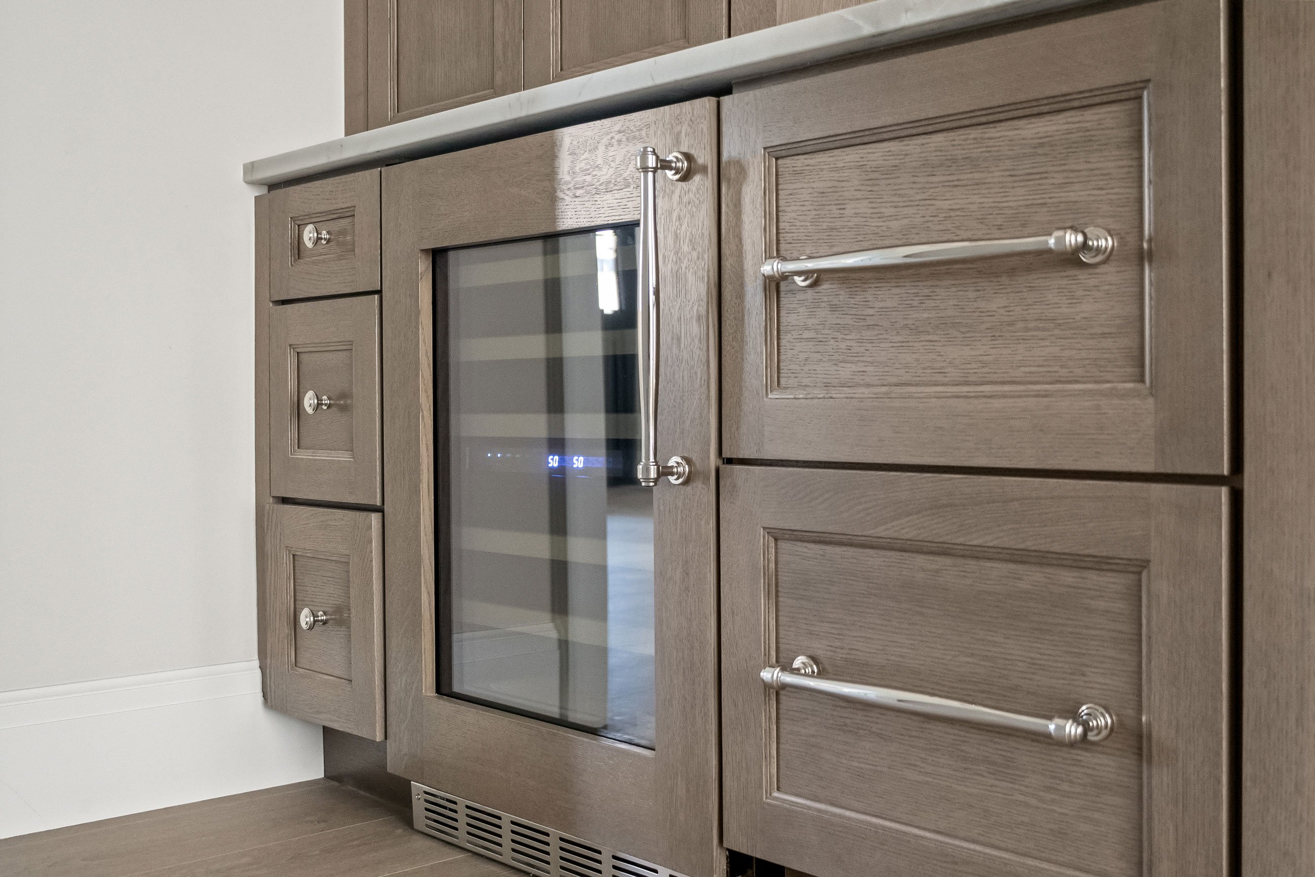 Butler’s pantry with wine refrigerator.