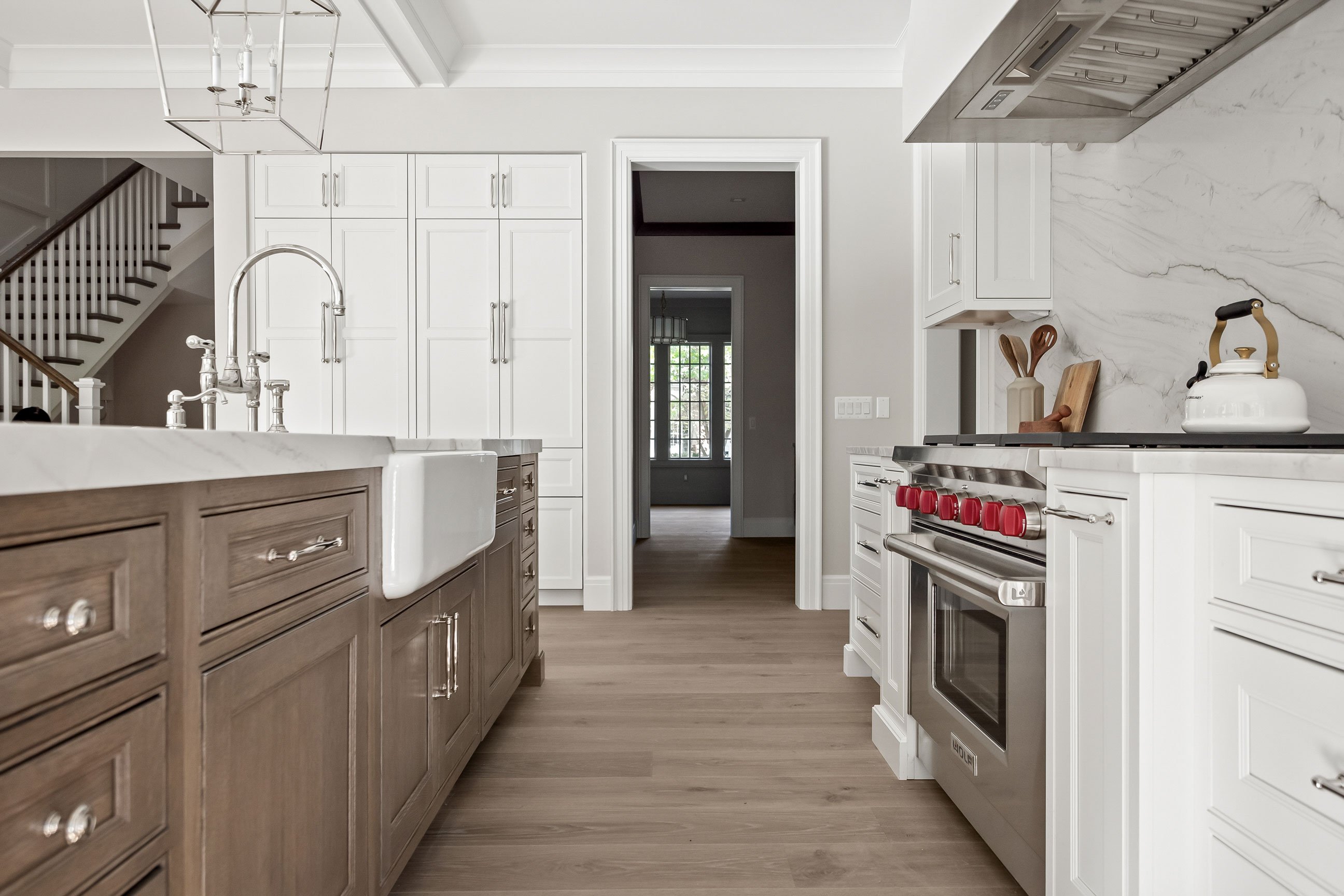 transitional two-tone kitchen with farm sink