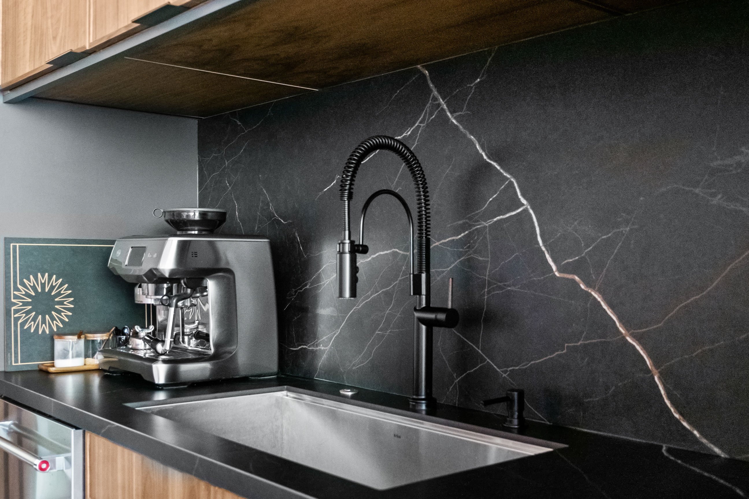 Sink detail with dark porcelain backsplash