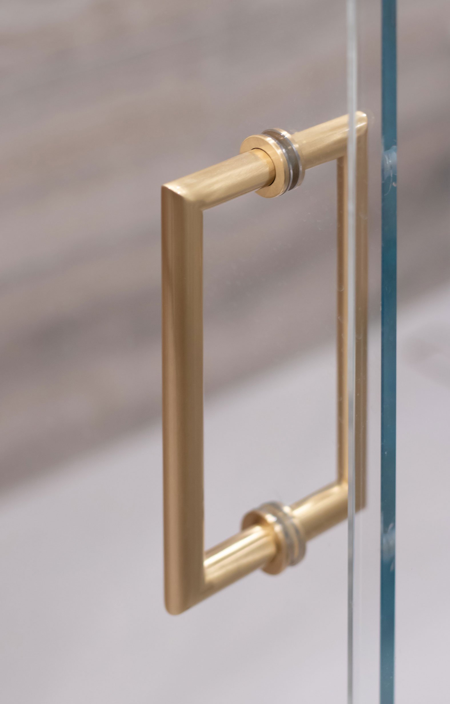 Gold shower door handle detail