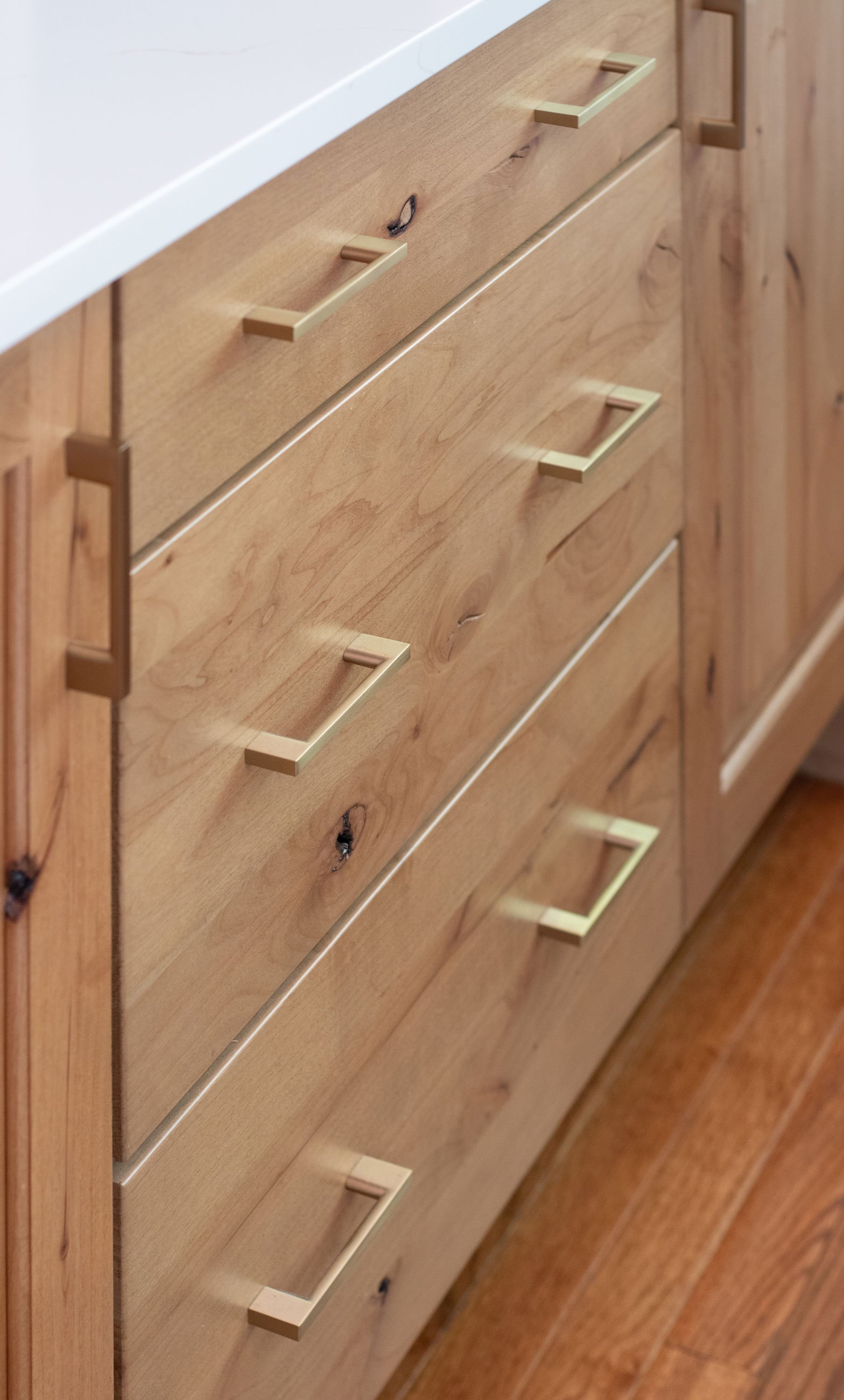 Kitchen island featuring rustic hickory cabinetry