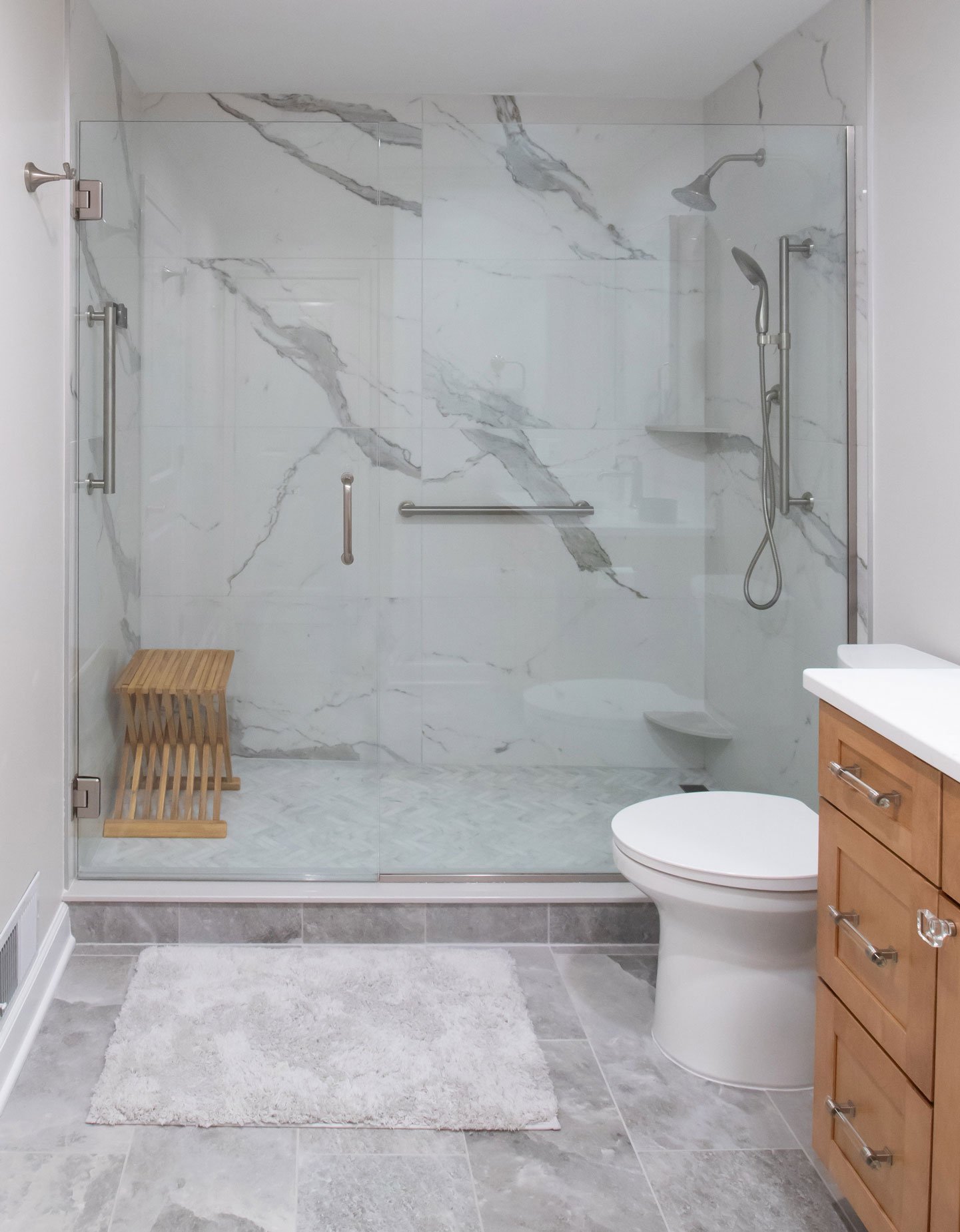 Accessible aging-in-place bath remodel with ADA handrails and Kohler Anthem digital shower system