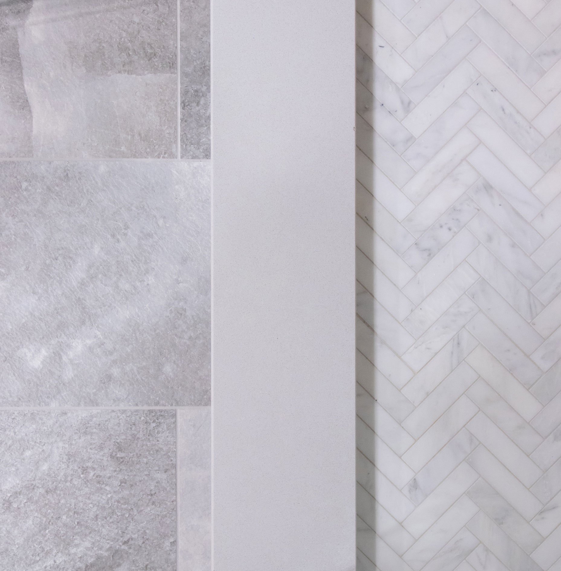 Mix of modern tile used on bath floor, threshold, and shower