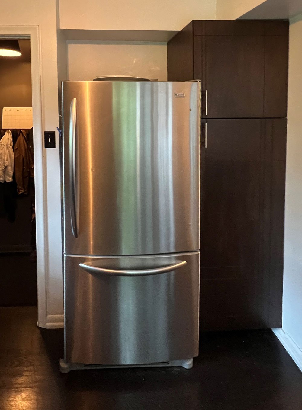 Dramatic Fridge Dark, Dramatic, and Delightfully Functional: A Small Kitchen Reimagined