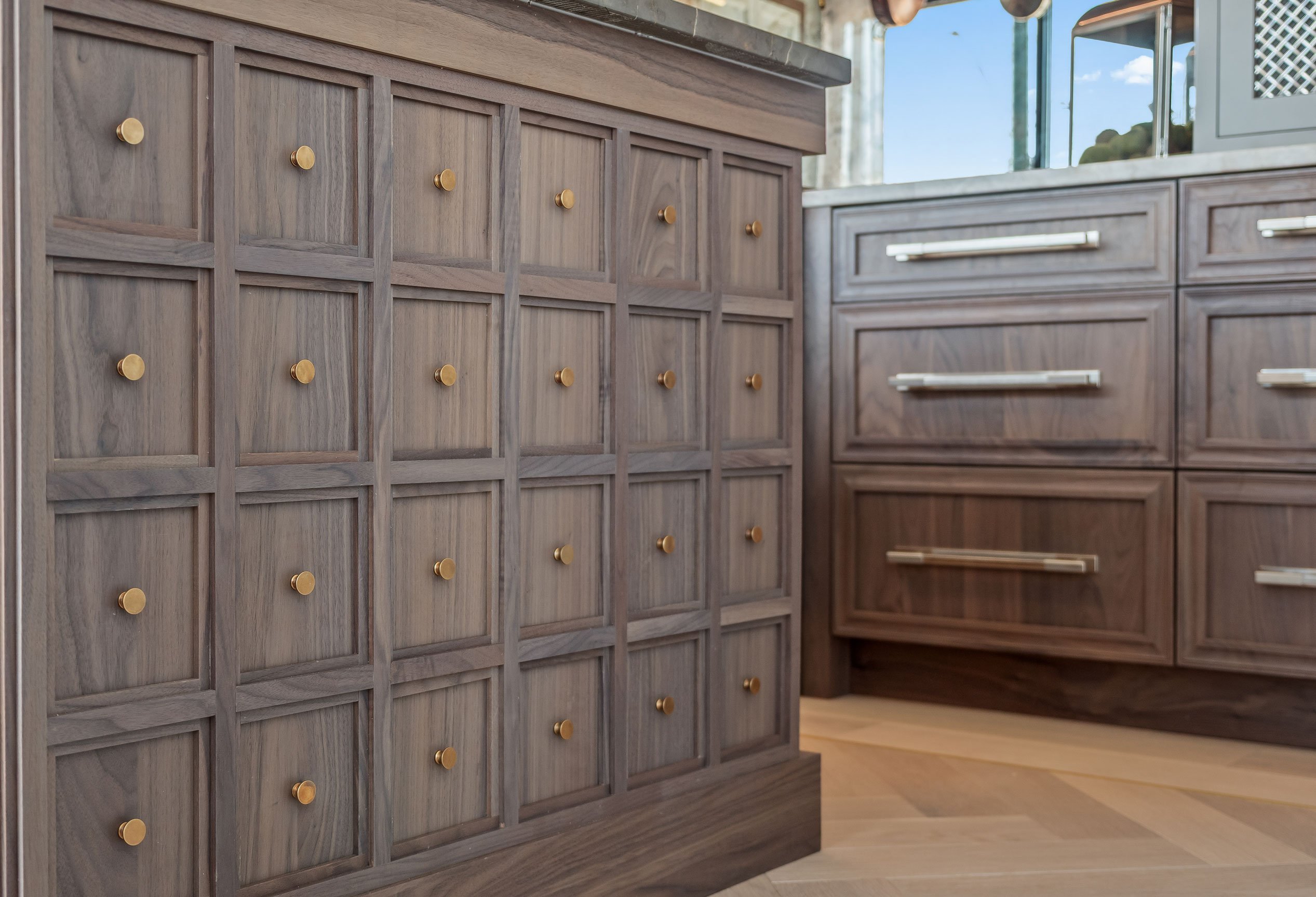 Kitchen island with apothocary drawer-style details