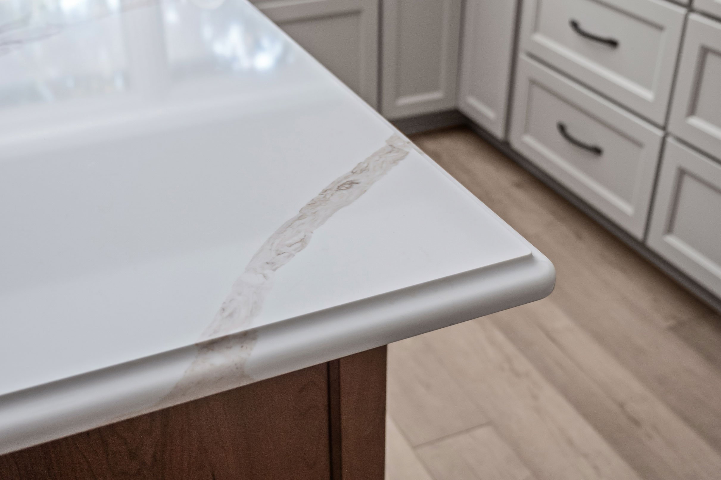 The quartz countertop's veining and seam detail up close.