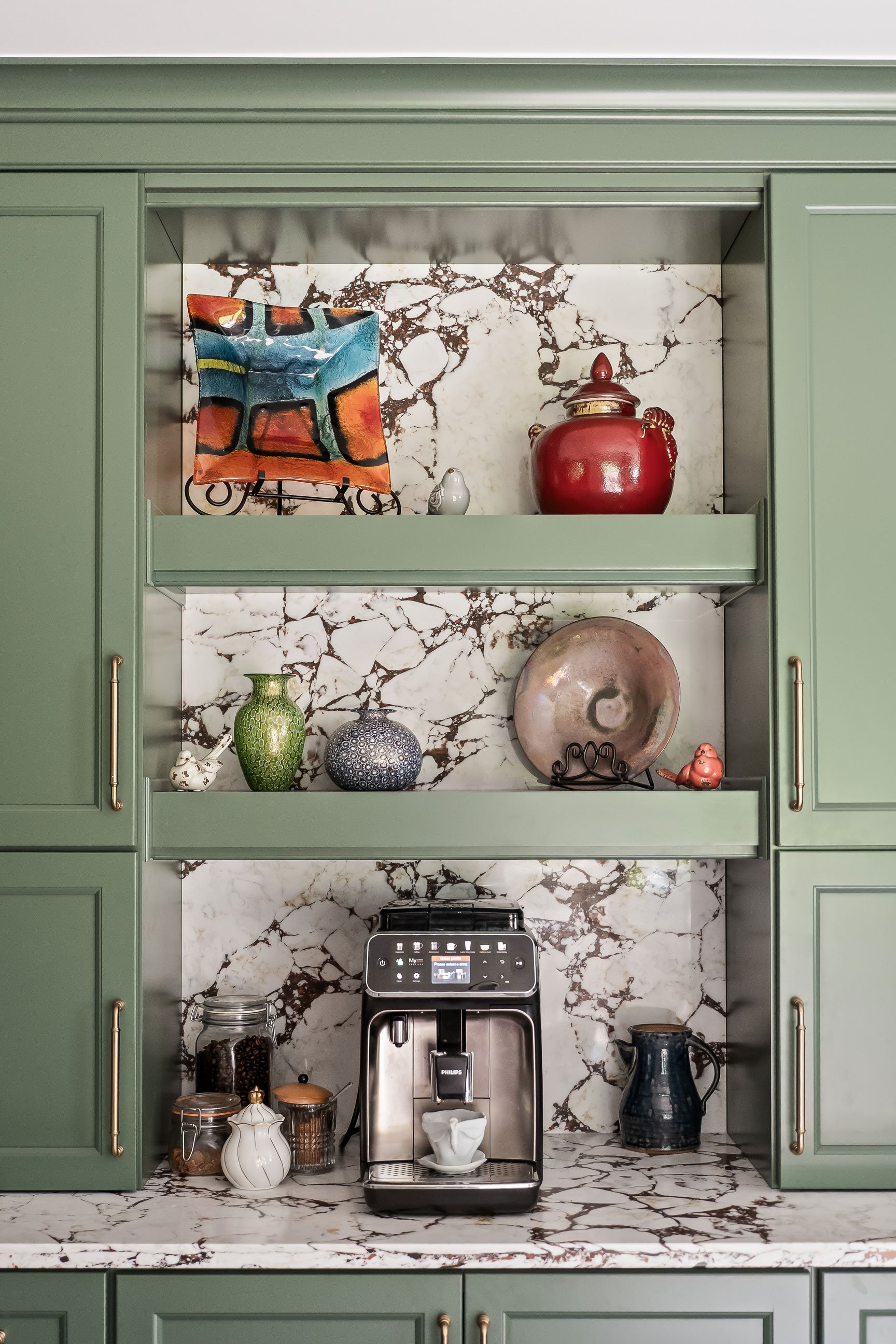 Another view of the coffee station's styled open shelving and built-in espresso machine.