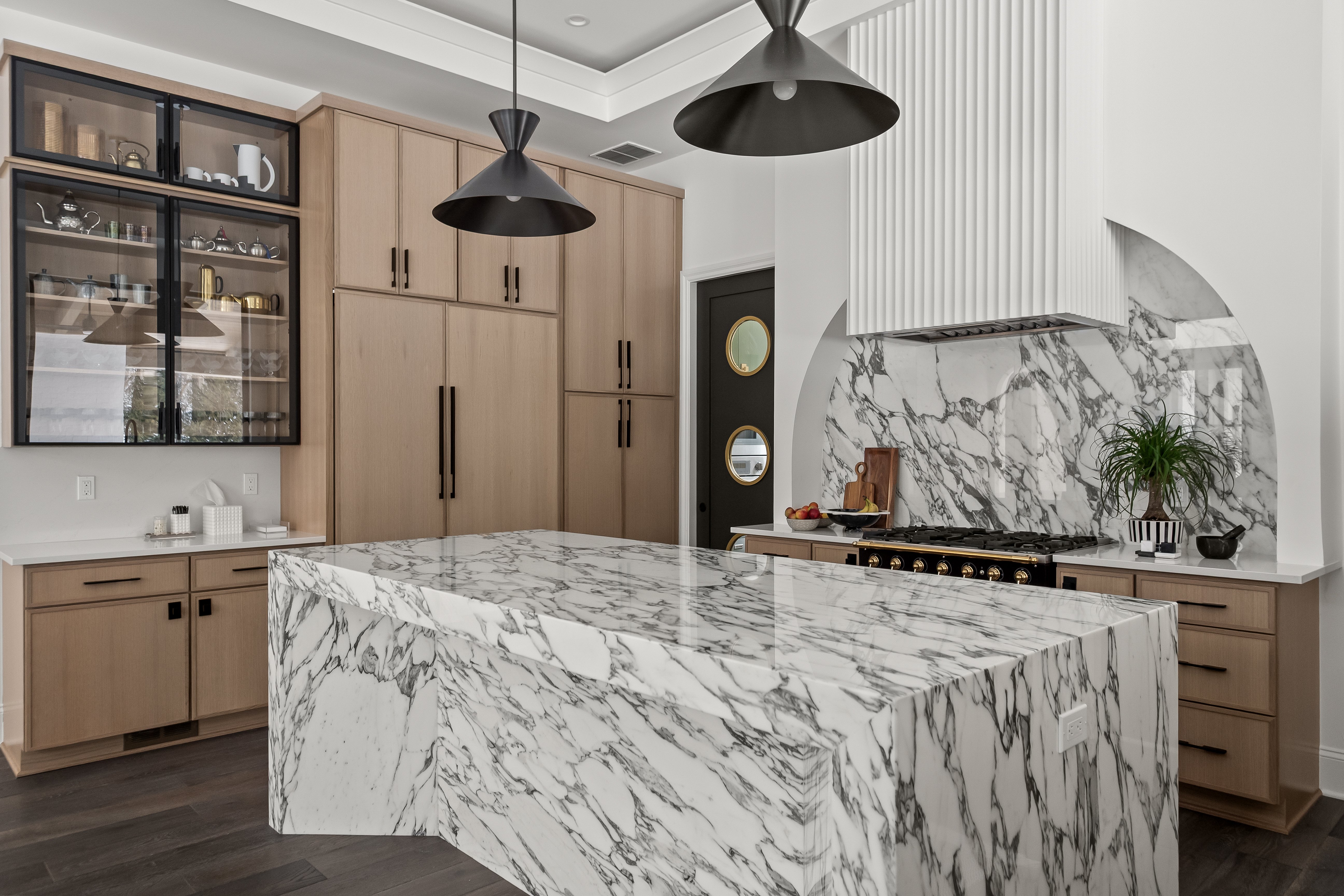 modern kitchen featuring hidden paneled refrigerator