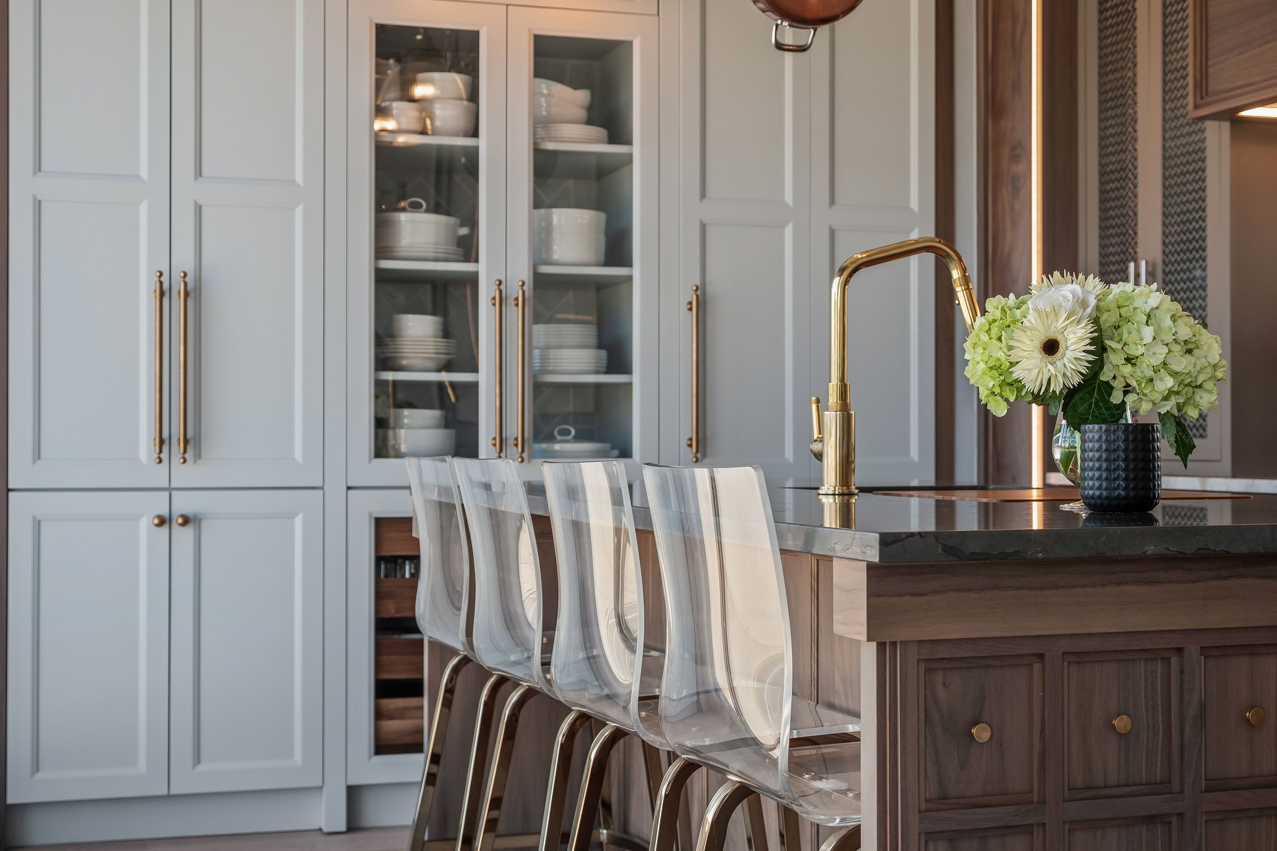 Mix of cabinetry with shaker and microshaker styles in painted and stained walnut finishes