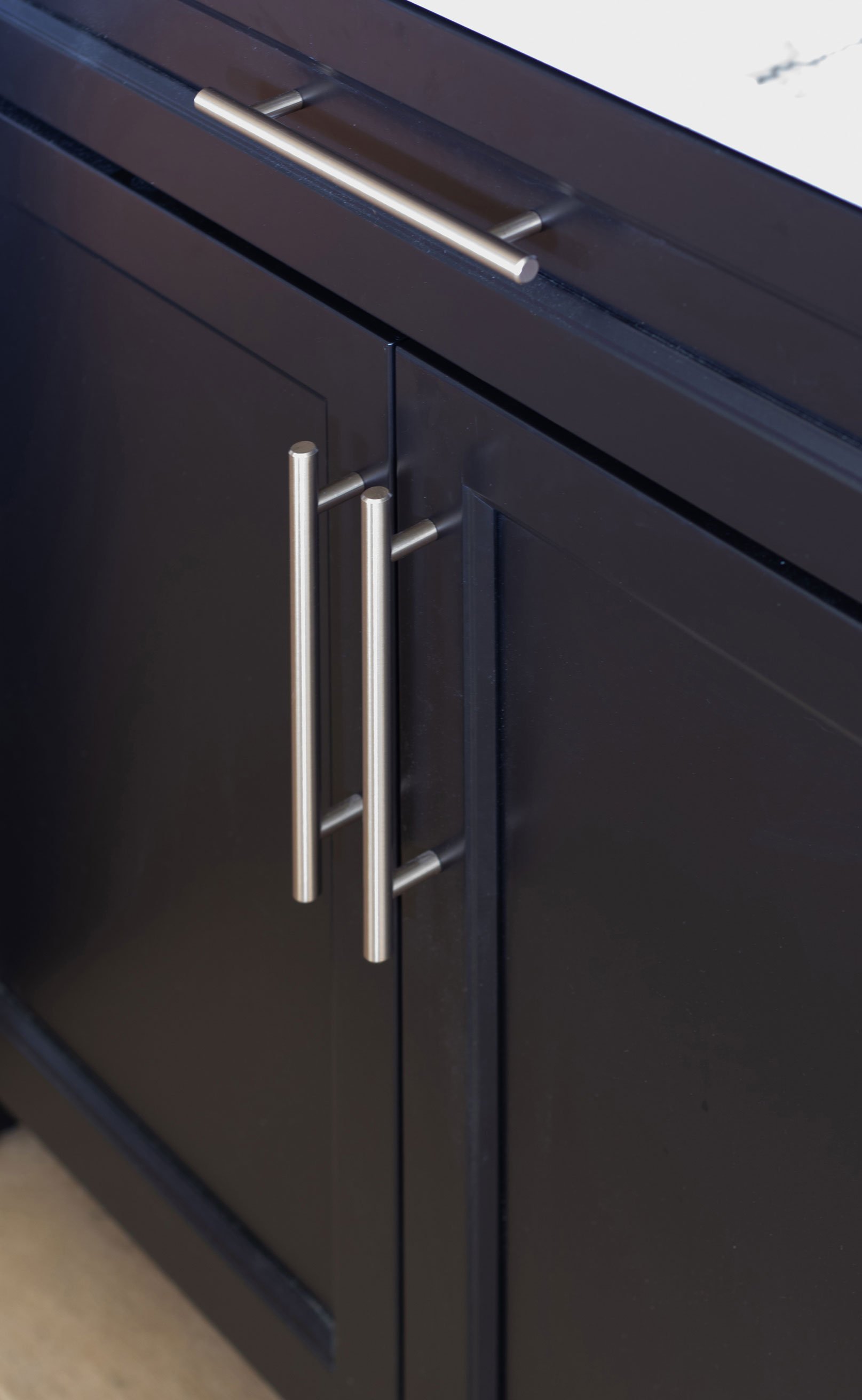 Onyx painted cabinetry in dark and moody bar.