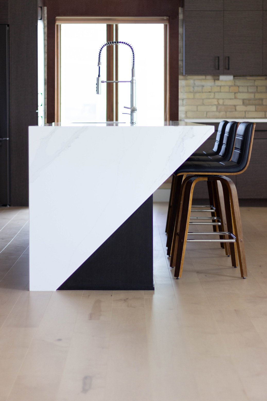 Beautiful Angeled Waterfall Island Countertop and Cabinetry