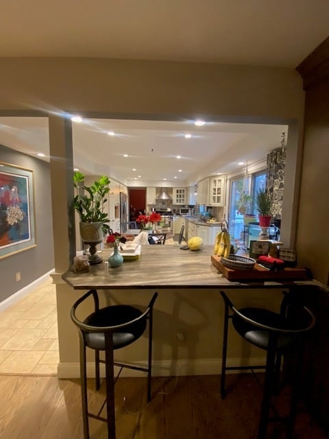 The original kitchen's peninsula and pass-through bar, which separated the space from the living room before the remodel.