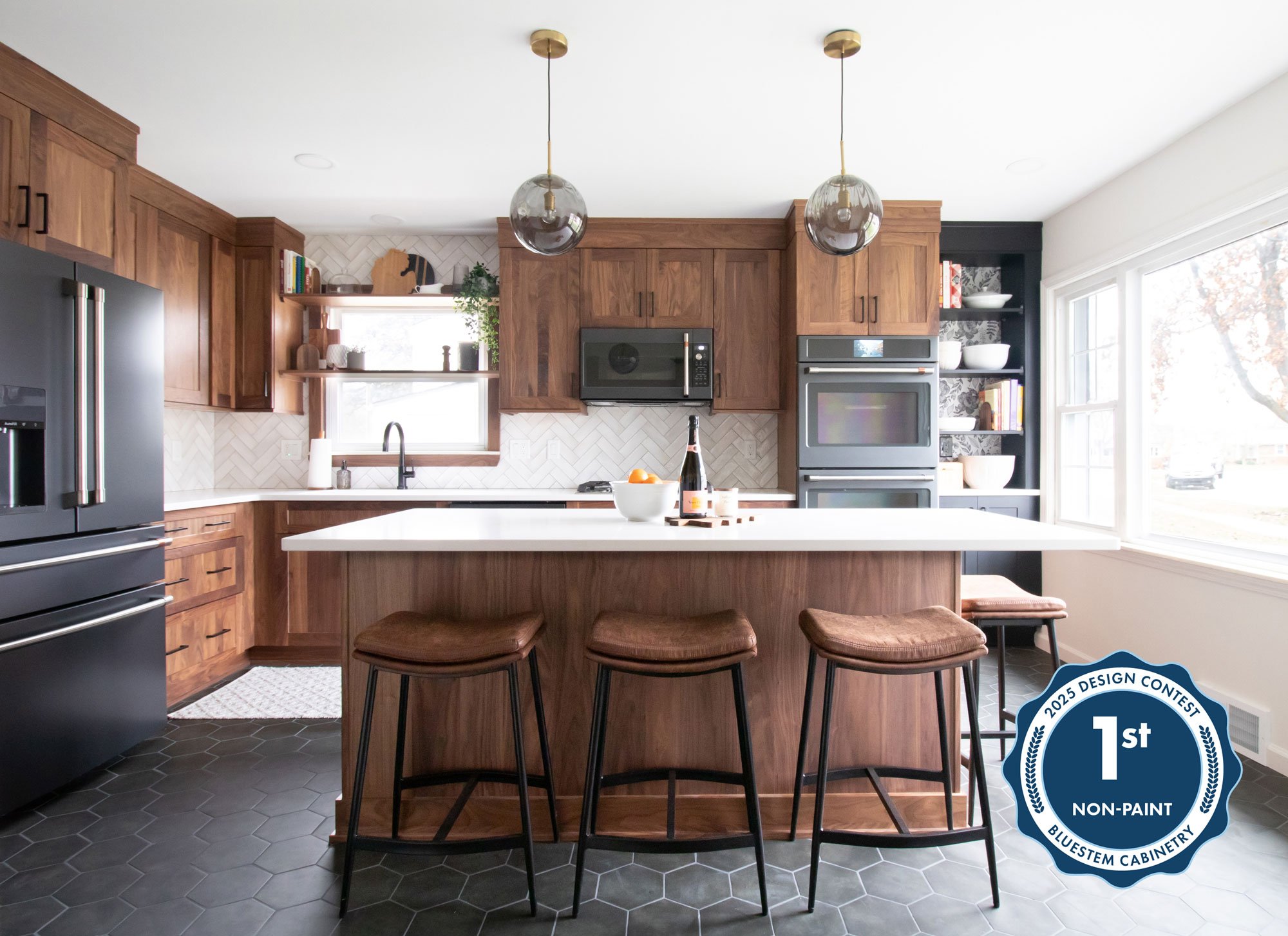 Inspira Cabinetry in natural walnut with matte black hardware and appliances