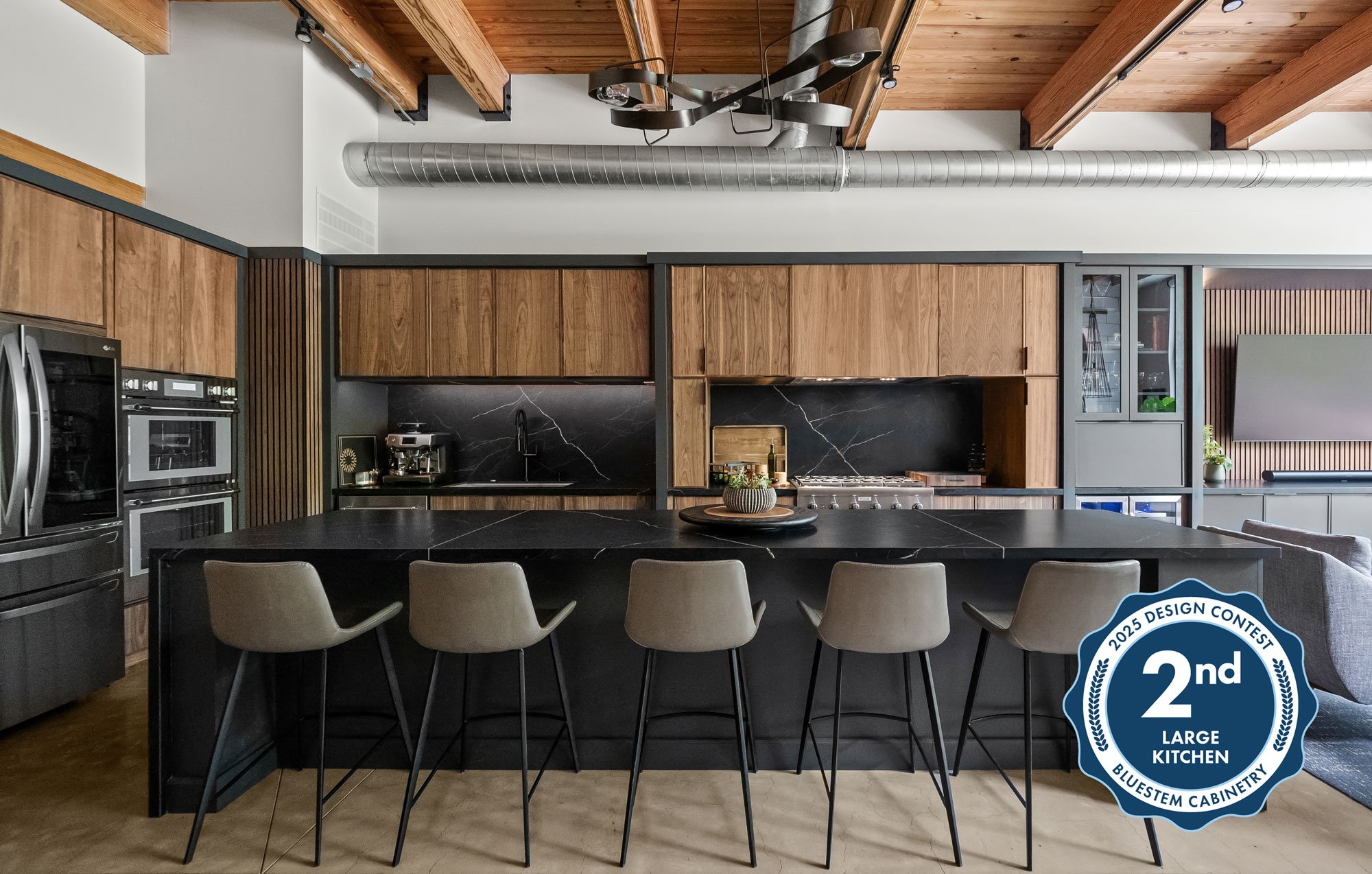 Contemporary loft kitchen featuring modern natural walnut slab cabinetry from Inspira Cabinetry
